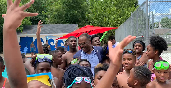 Sankey laughing with children