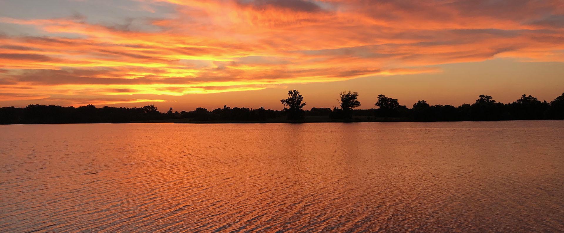 waters orange sunset cropped 1920 x 793 - resized